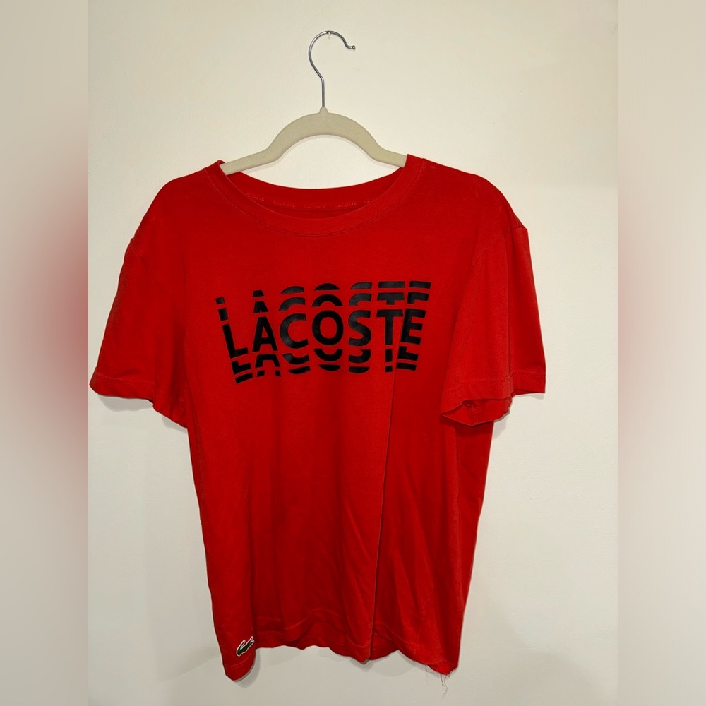 Red Lacoste shirt
